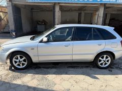 Сүрөт унаа Mazda 323