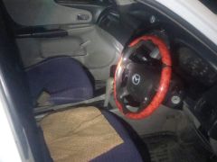 Photo of the vehicle Mazda 323